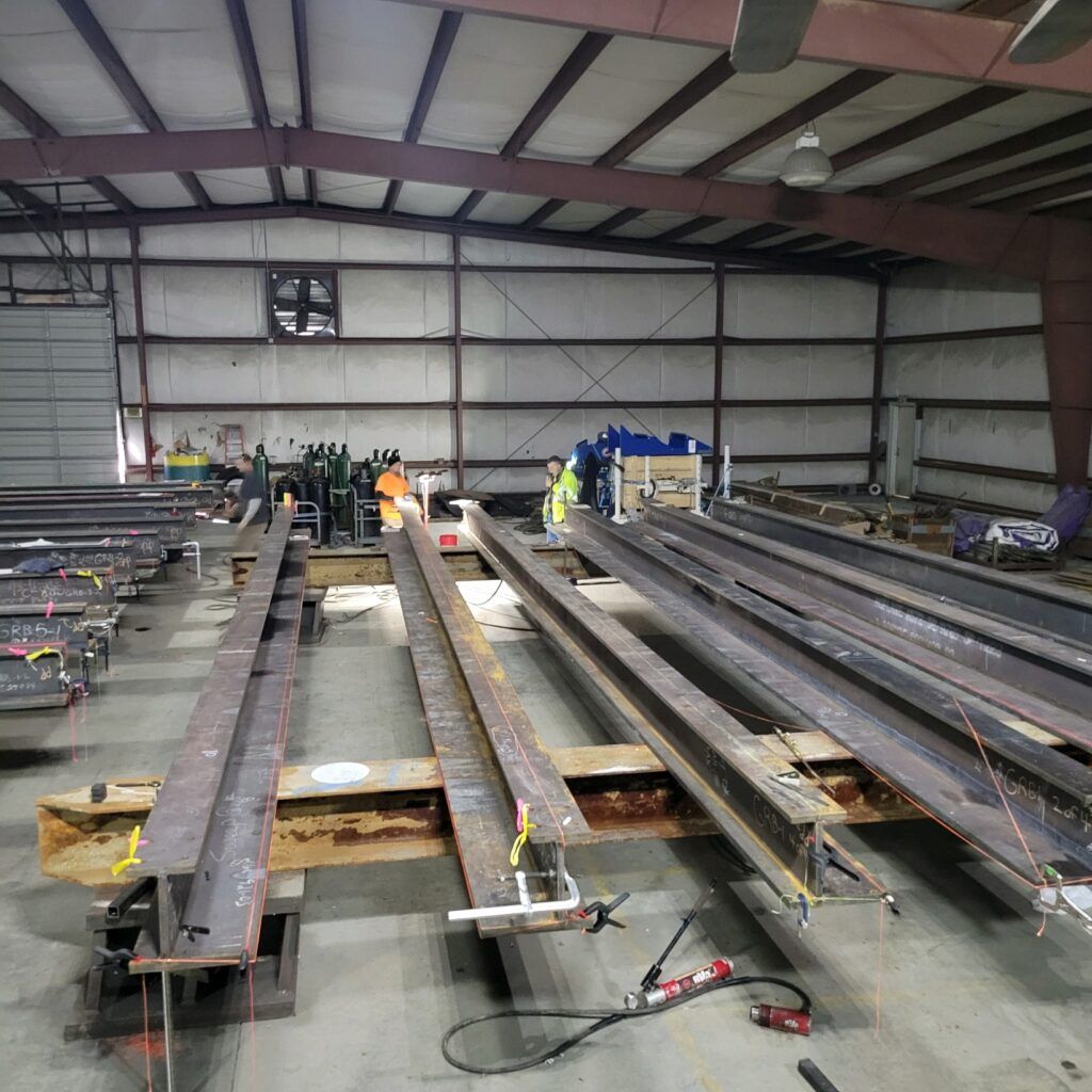 Workers in an industrial facility with steel beams and construction materials have provided glowing testimonials.